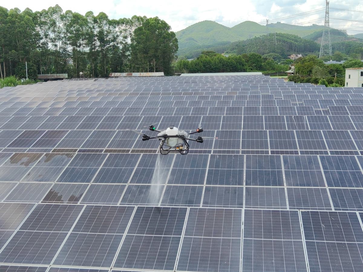 Professional window cleaning drone servicing high-rise building with specialized equipment