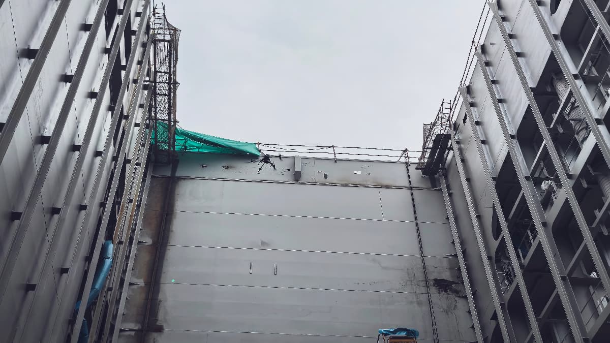 DJI Matrice drone performing automated bubble testing on ship hull welds for leak detection
