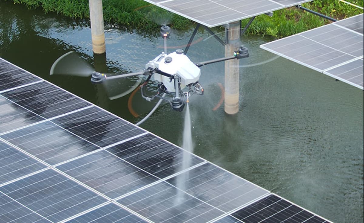 Professional drone window cleaning operation on high-rise building facade Professional drone window cleaning operation on high-rise building facade