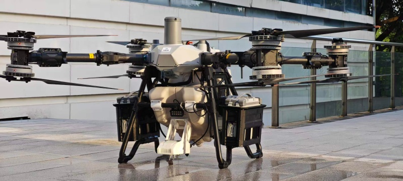 DJI Matrice M400 industrial drone fitted with modular cleaning kit cleaning glass facade of high-rise building DJI Matrice M400 industrial drone fitted with modular cleaning kit cleaning glass facade of high-rise building