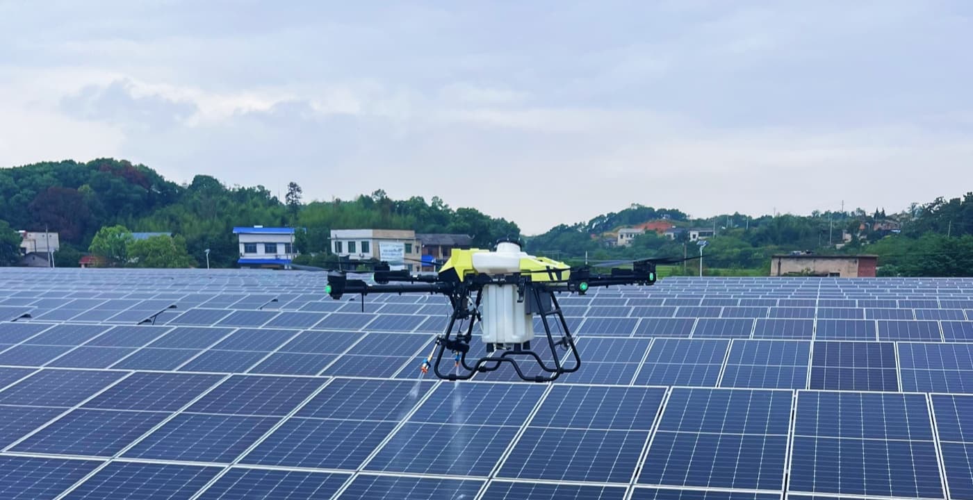 C40B drone cleaning solar panels on industrial rooftop array C40B drone cleaning solar panels on industrial rooftop array