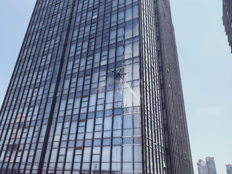 Highrise drone window cleaning before and after comparison on hotel glass façade using window cleaning drones Highrise drone window cleaning before and after comparison on hotel glass façade using window cleaning drones