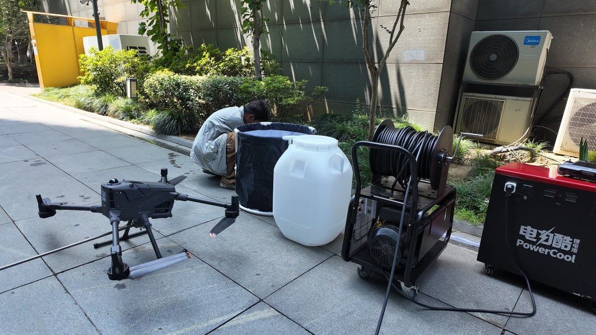 Aerial view of a glass curtain wall high-rise tower before drone facade cleaning Aerial view of a glass curtain wall high-rise tower before drone facade cleaning